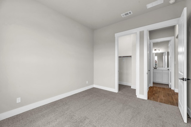 unfurnished bedroom with carpet floors