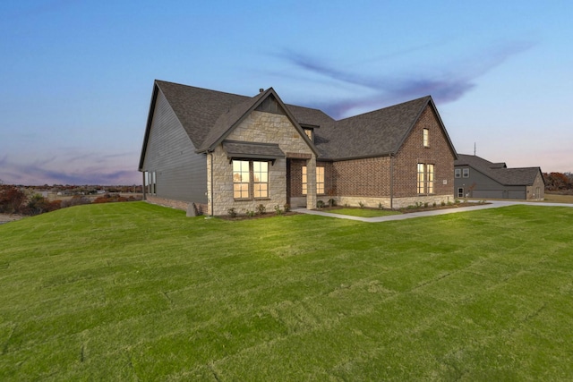 view of front of home with a yard