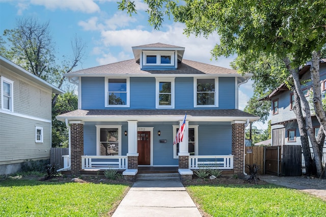 view of front of house with a front lawn and a porch