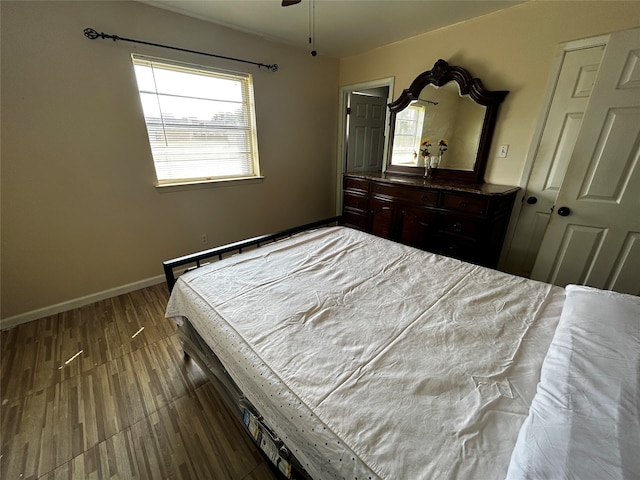 bedroom with hardwood / wood-style flooring