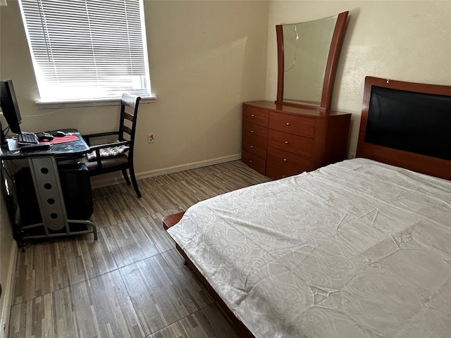 bedroom featuring hardwood / wood-style flooring