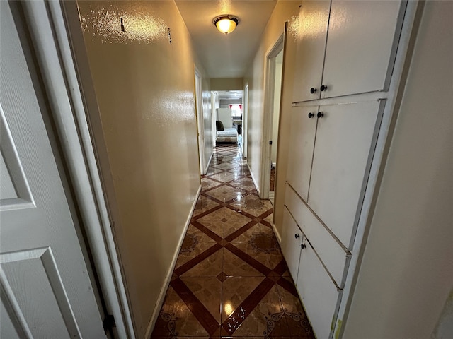 corridor featuring light tile patterned floors