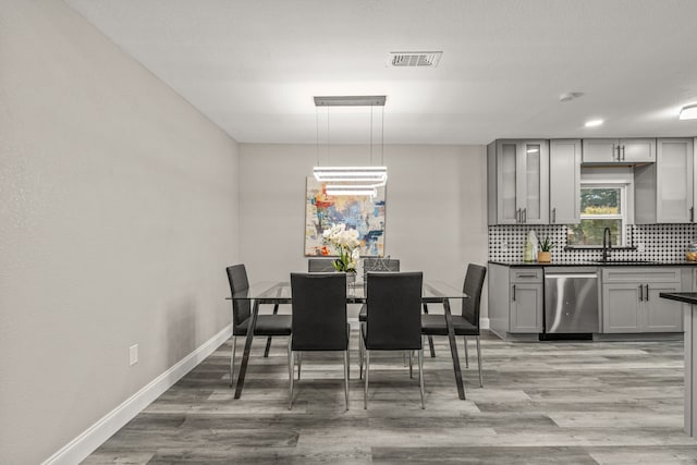 dining room with light wood-type flooring