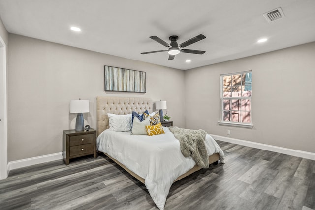 bedroom with dark hardwood / wood-style floors and ceiling fan