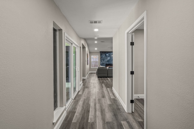 hall with wood-type flooring