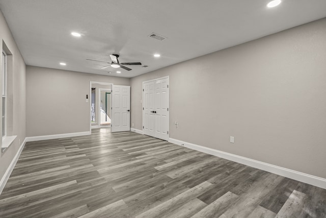 unfurnished room featuring ceiling fan and hardwood / wood-style flooring