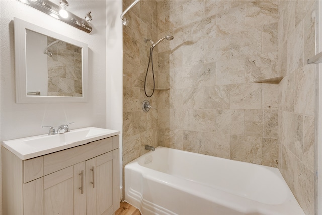 bathroom featuring vanity and tiled shower / bath combo