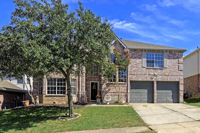 view of front of home featuring a front yard and a garage