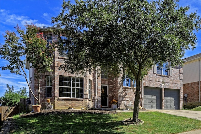 view of front facade featuring a front yard and a garage