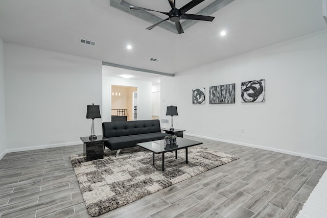 living room with ceiling fan, a fireplace, sink, and light hardwood / wood-style flooring