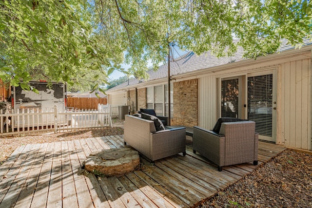 wooden terrace with an outdoor hangout area