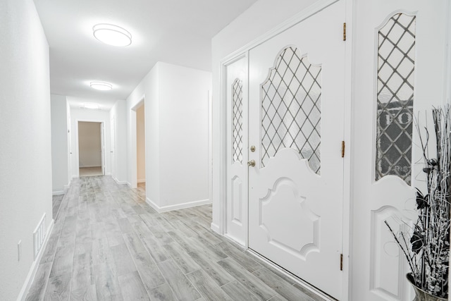 living room with ceiling fan and light hardwood / wood-style floors