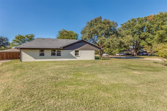 back of property with a yard