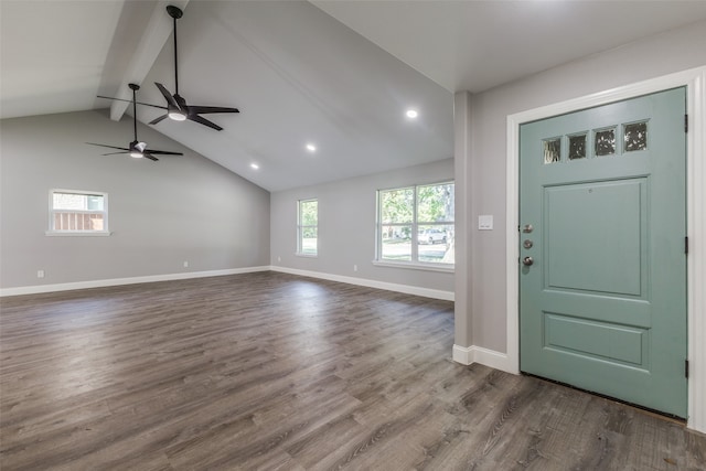 foyer with ceiling fan, lofted ceiling with beams, and dark hardwood / wood-style floors