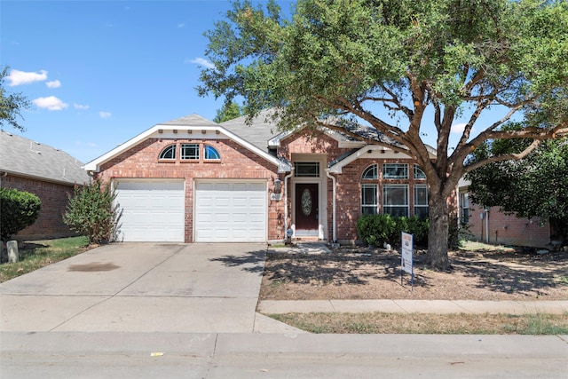 view of front of property with a garage