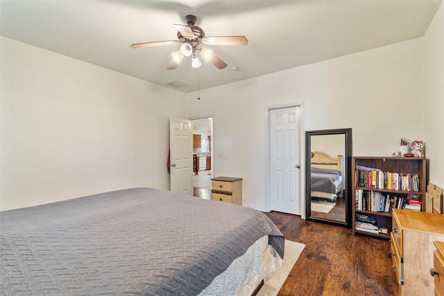 bedroom with ceiling fan and dark hardwood / wood-style floors