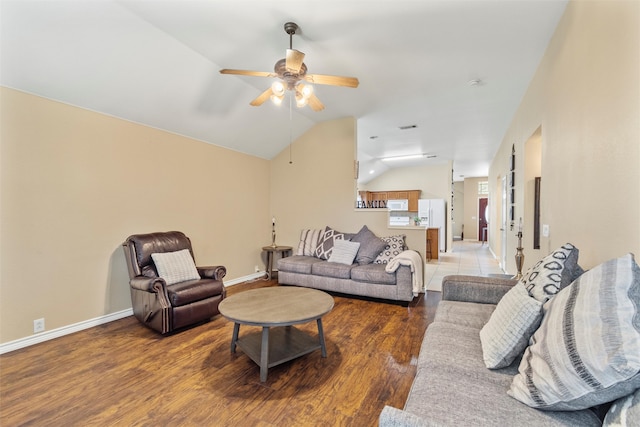 living room featuring ceiling fan, hardwood / wood-style flooring, and lofted ceiling