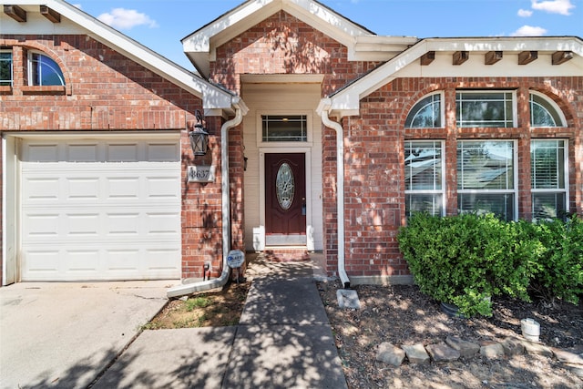 doorway to property featuring a garage