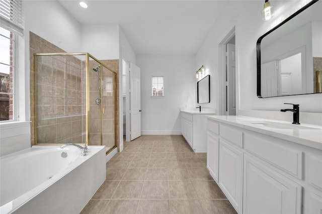 bathroom featuring vanity, tile patterned floors, and separate shower and tub