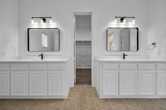 bathroom with vanity and tile patterned flooring