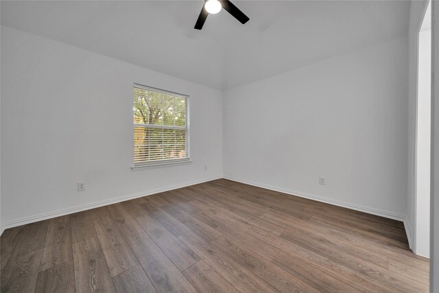 empty room featuring wood-type flooring and ceiling fan