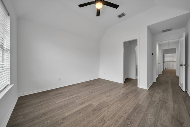 interior space featuring lofted ceiling, dark hardwood / wood-style floors, and ceiling fan