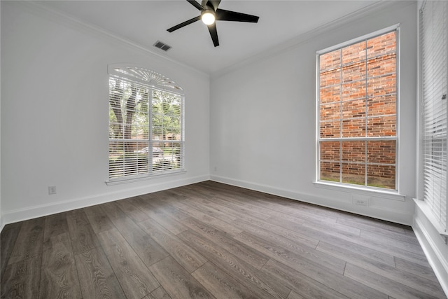 empty room with hardwood / wood-style floors, crown molding, and ceiling fan