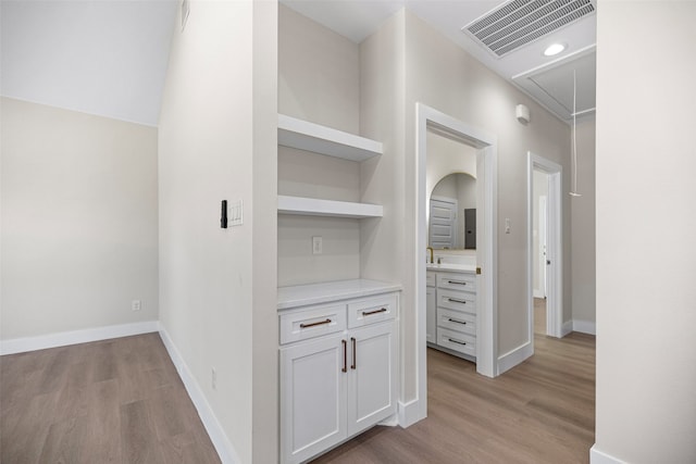 corridor featuring light hardwood / wood-style floors