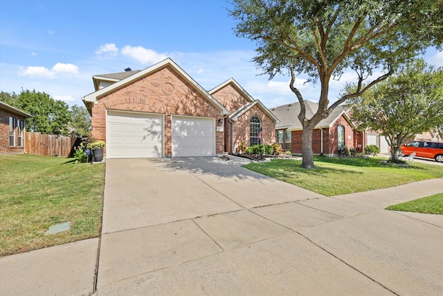 view of front of house featuring a front lawn and a garage