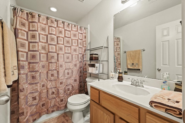 bathroom featuring vanity, tile patterned flooring, toilet, and a shower with curtain