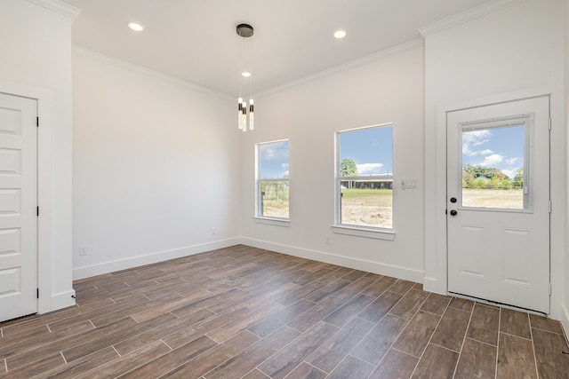 interior space with ornamental molding, dark wood-type flooring, and a healthy amount of sunlight