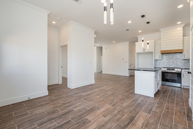 kitchen featuring hanging light fixtures, white cabinetry, electric stove, a center island, and dark hardwood / wood-style floors