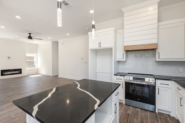 kitchen with pendant lighting, white cabinetry, stainless steel range, and dark hardwood / wood-style floors