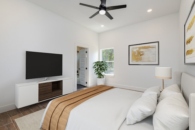 bedroom featuring dark hardwood / wood-style flooring and ceiling fan