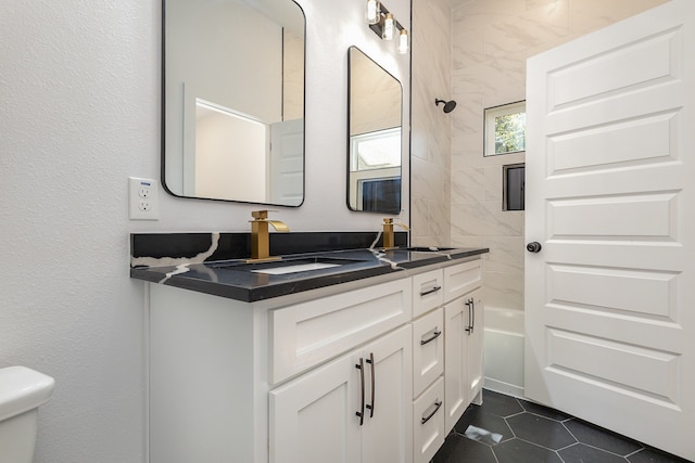 full bathroom with bathtub / shower combination, tile patterned floors, vanity, and toilet