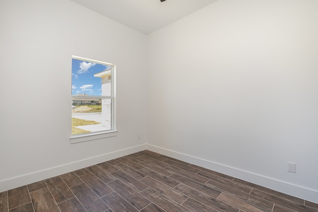 unfurnished room featuring dark wood-type flooring