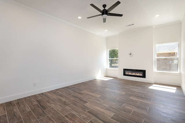 unfurnished living room with crown molding, dark hardwood / wood-style flooring, and ceiling fan