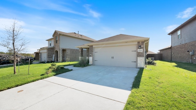 view of front of property with a garage and a front lawn