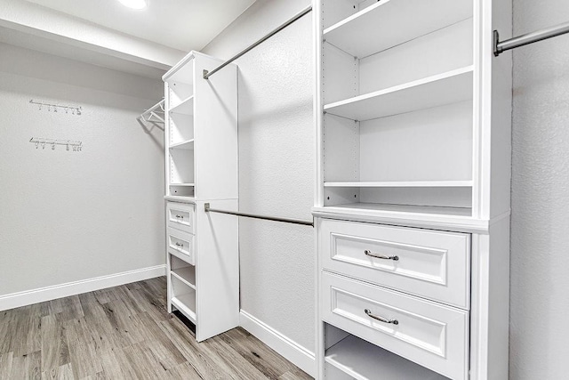 walk in closet featuring light wood-type flooring