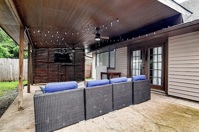 home theater room featuring plenty of natural light and wood ceiling