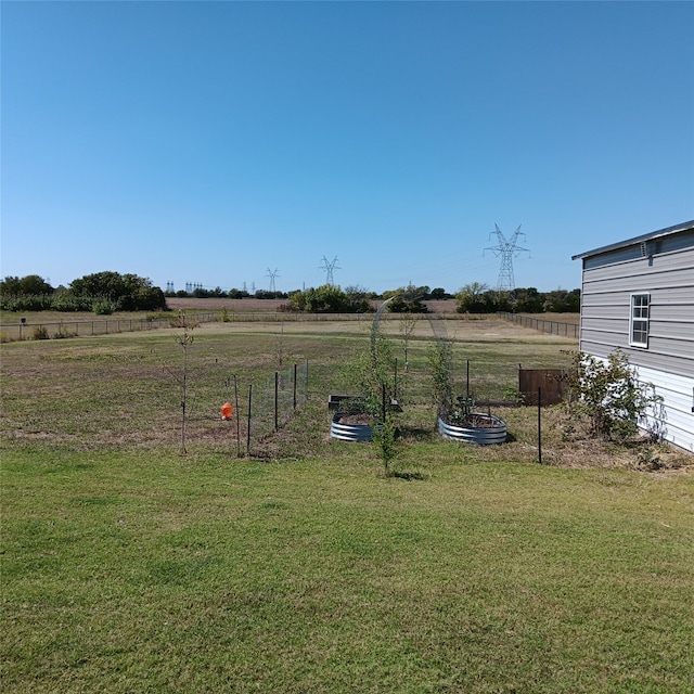 view of yard with a rural view