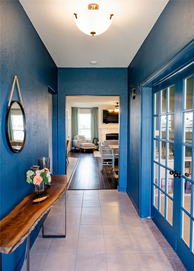 corridor with hardwood / wood-style floors