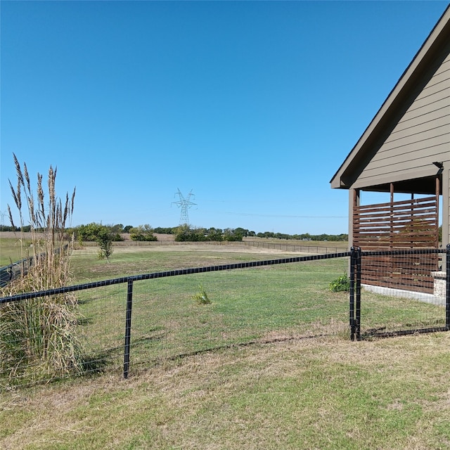 view of yard with a rural view