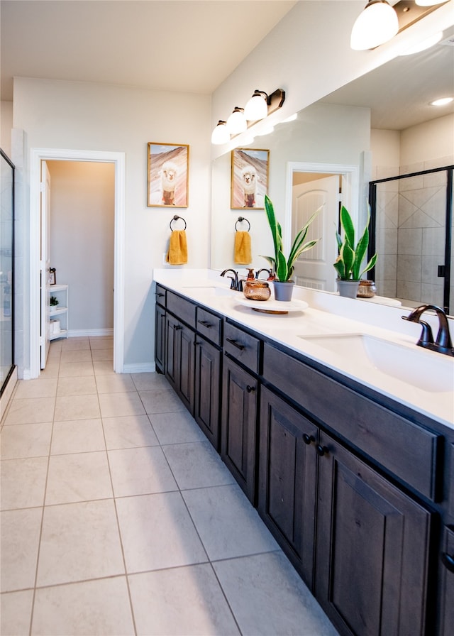 bathroom with vanity, walk in shower, and tile patterned floors