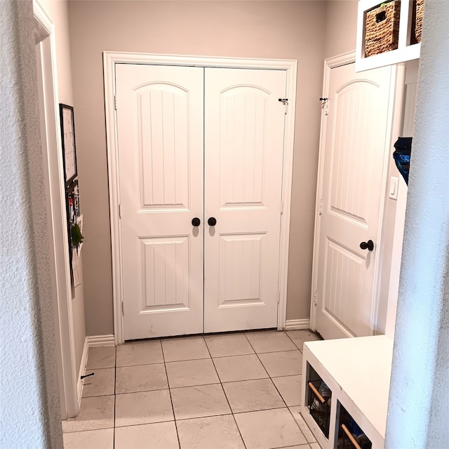 interior space featuring light tile patterned floors