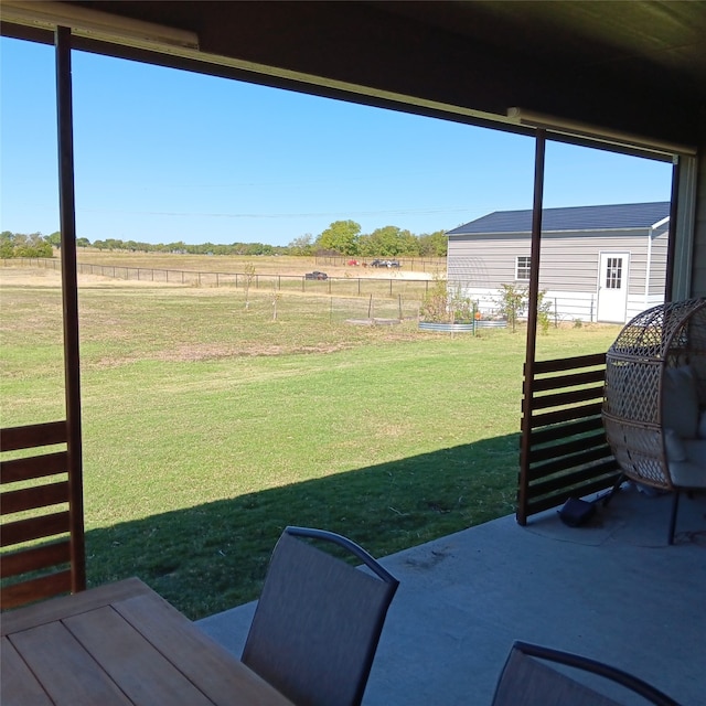 view of yard featuring a patio area and a rural view