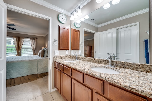 bathroom featuring crown molding, vanity, ceiling fan, and tile patterned floors