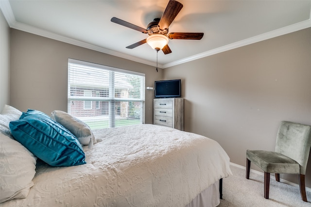 bedroom with ceiling fan, ornamental molding, and carpet flooring