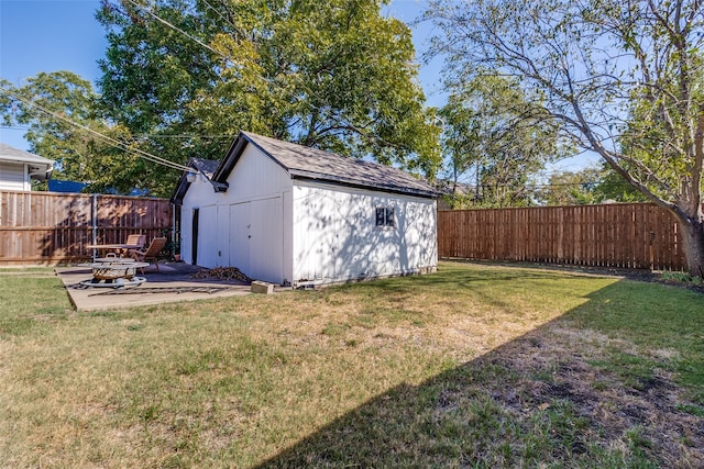 view of outdoor structure featuring a lawn