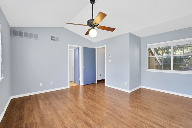 spare room featuring hardwood / wood-style flooring, ceiling fan, and lofted ceiling